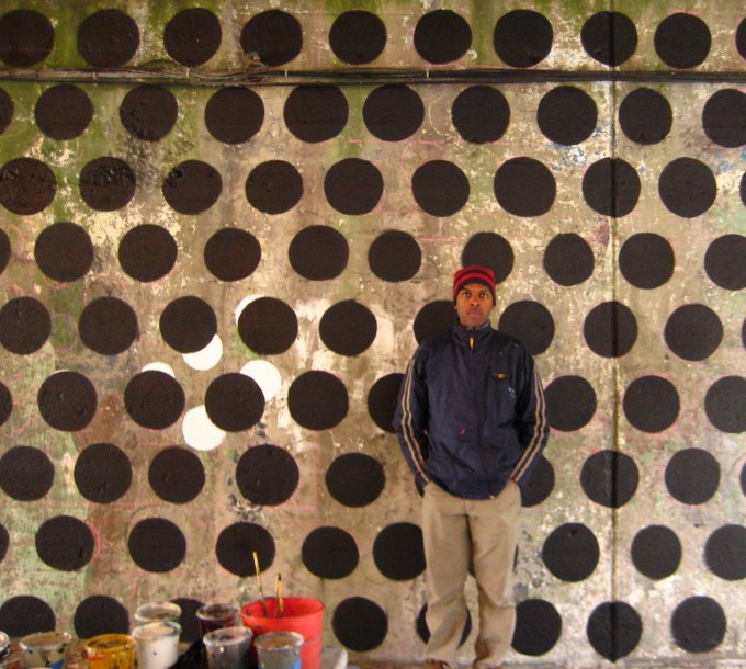 Williams with the restored and "reinterpreted" mural by Astrid Fuller, the Spirit of Hyde Park